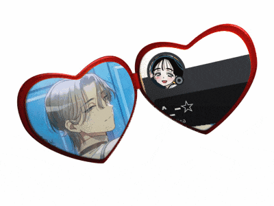 a pair of heart shaped sunglasses with a picture of a boy and a girl on them