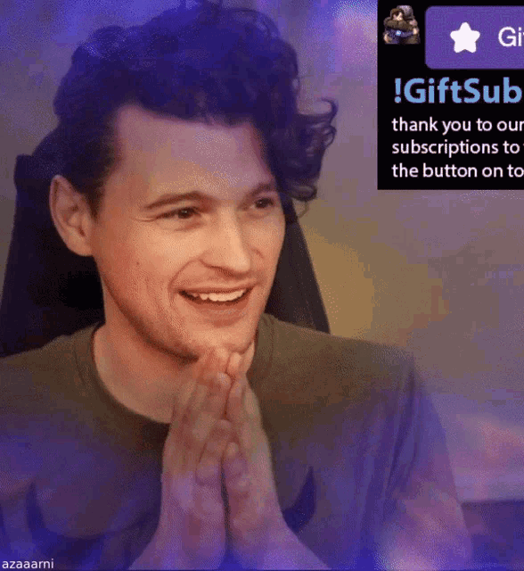 a man is smiling in front of a sign that says ' gift subscriptions '