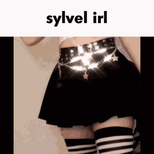 a woman wearing a black skirt and striped socks has sylvel irl written on the top