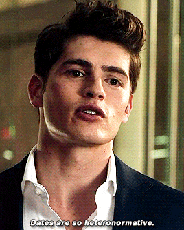 a man in a suit and white shirt is saying dates are so heteronormative