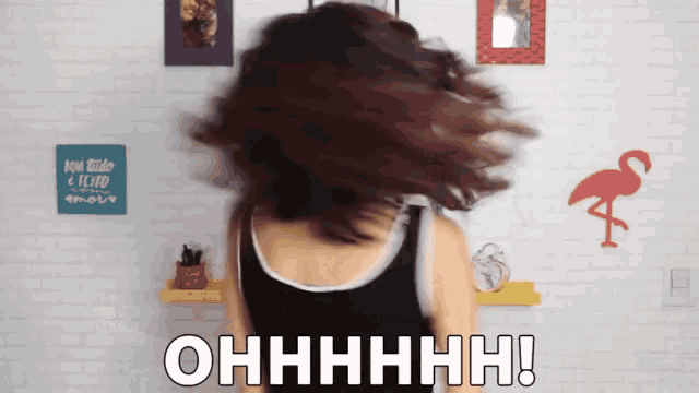 a woman 's hair is blowing in the wind and the words ohhhh are visible
