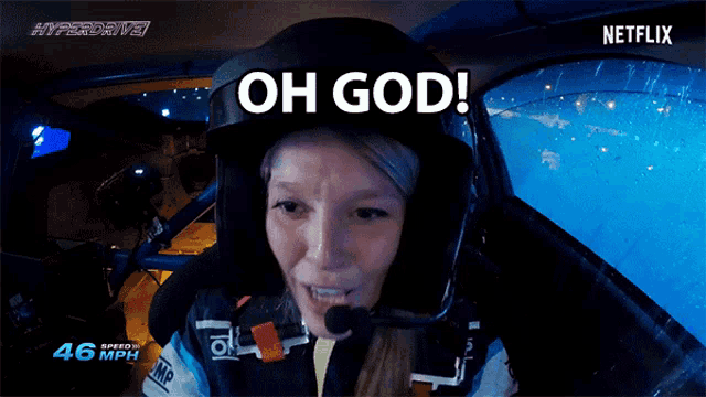 a woman wearing a helmet and a microphone says oh god