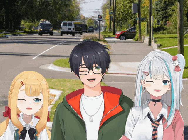 a boy and two girls are standing on the side of a road