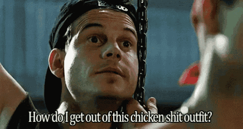 a man with chains around his neck says how do i get out of this chicken shit outfit