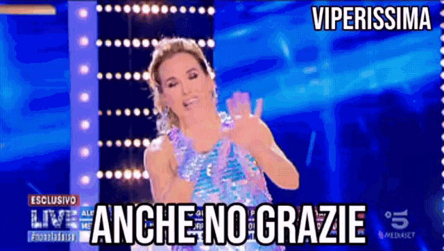 a woman in a sequined dress is on a stage with the words viperissima above her