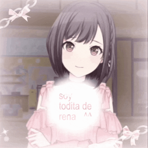 a girl in a pink dress is holding a sign that says su todita de rena aa
