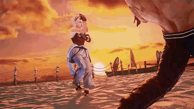 a man and a woman are playing a video game on the beach .