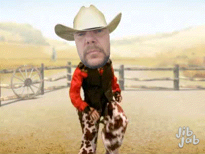 a man in a cowboy hat and cow print pants is dancing
