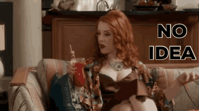 a woman is sitting on a couch with a drink in her hand and the words " no idea " on the bottom