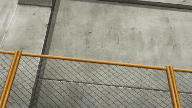 a person laying on the ground with their feet on a fence