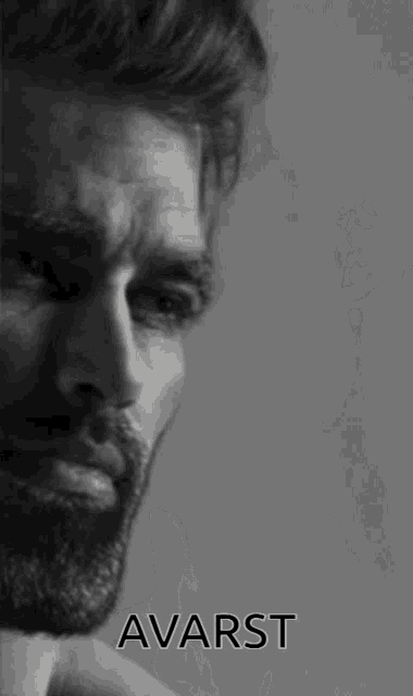 a black and white photo of a man with a beard and the word avarst above him