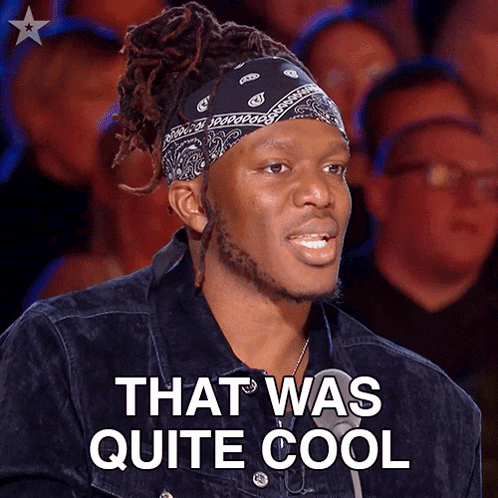a man wearing a bandana says that was quite cool in front of a crowd