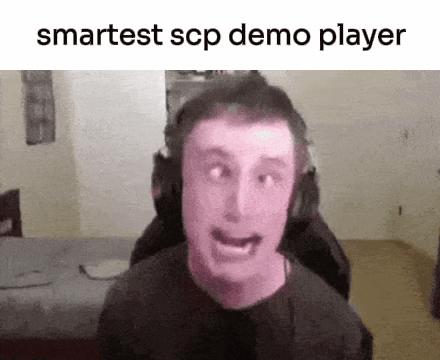 a man wearing headphones is making a funny face while sitting in a chair in a room .