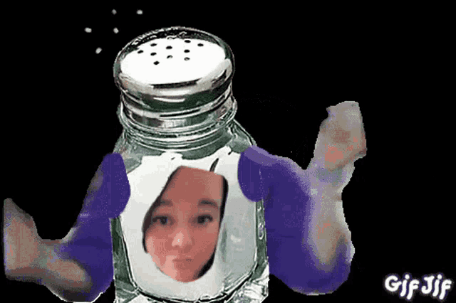 a salt shaker with a woman 's face inside of it