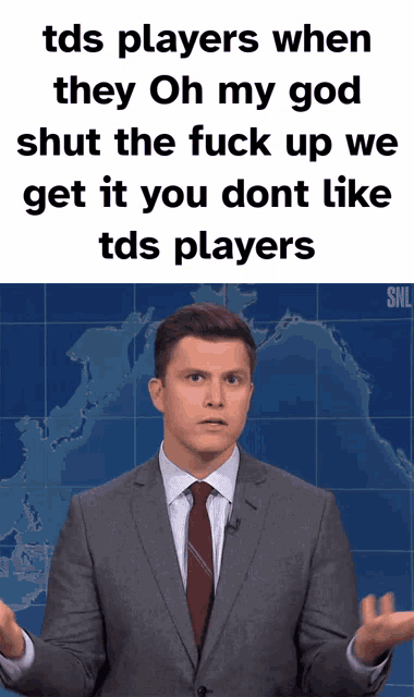 a man in a suit and tie is standing in front of a map and says tds players