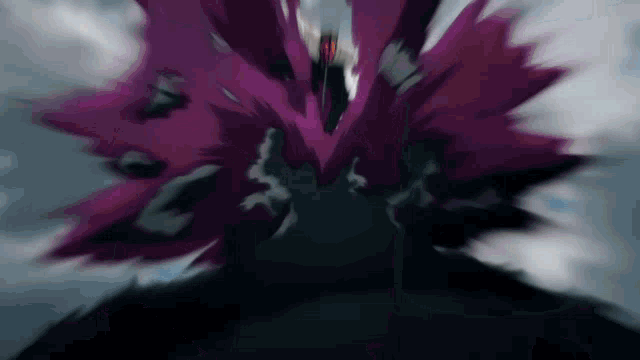 a blurry picture of a purple flower with a black background