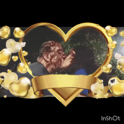 a couple kissing in a heart shaped frame