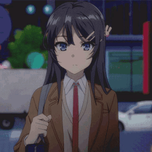 a girl with long hair and blue eyes is wearing a brown jacket and tie