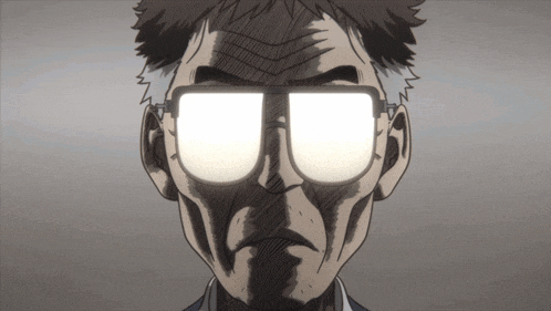 a close up of a man wearing glasses with a light shining through them