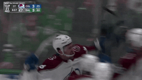 a hockey game is being played and the score is 3 to 2