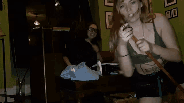 a man and a woman are dancing in a dark room
