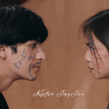 a man and a woman looking at each other with hearts drawn on their face