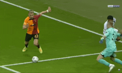 soccer players on a field with one wearing a jersey that says beko on it