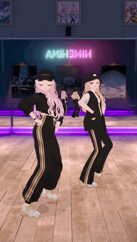 two girls are dancing in front of a neon sign that says amih3m1h
