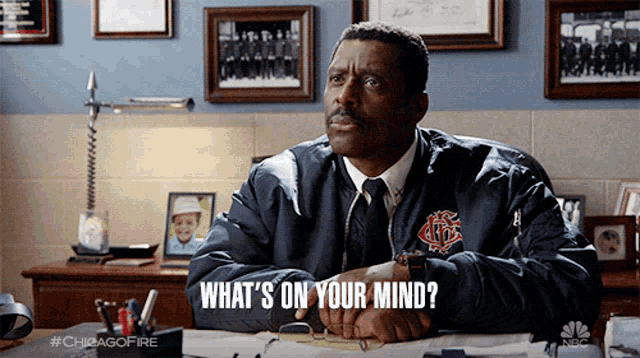 a man wearing a jacket that says chicago fire on it