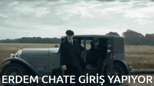 two men are getting out of a car with the words erdem chate giris yapiyor written below them