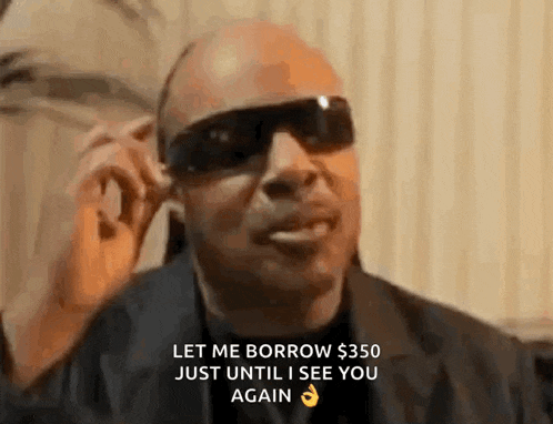 a man wearing sunglasses is talking on a cell phone and says `` let me borrow $ 350 just until i see you again ''