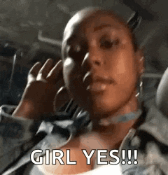 a woman is sitting in the back seat of a car talking on a cell phone and saying `` girl yes ! ''