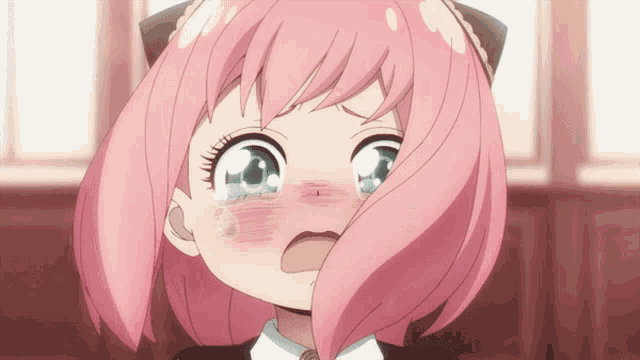 a little girl with pink hair is crying with tears coming out of her eyes