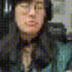 a woman wearing headphones and glasses is making a face .