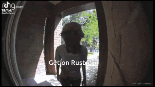 a ring doorbell shows a woman standing in a doorway with the caption get on rustbro