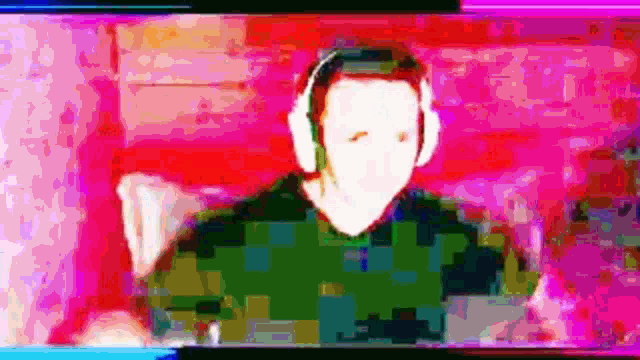 a blurry picture of a man wearing headphones .