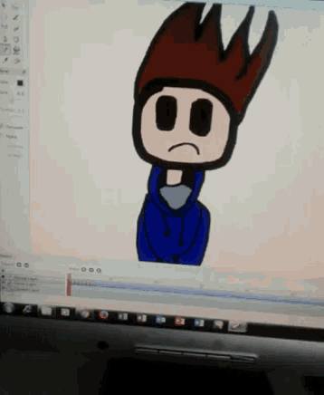 a computer screen shows a cartoon of a boy with a sad face