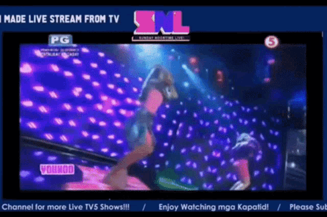a snl live stream shows a woman dancing on a stage