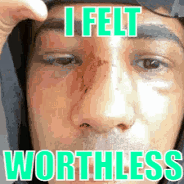 a close up of a man 's face with the words " i felt worthless " written on it
