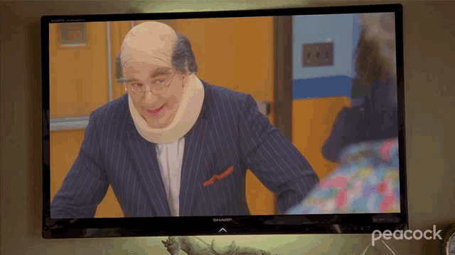 a man with a broken neck is on a sharp television