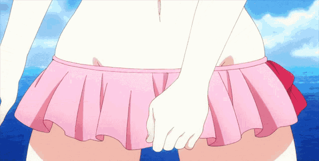 a woman in a pink skirt is holding her underwear