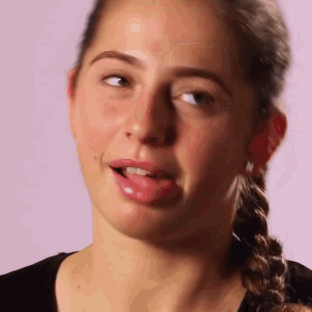 a close up of a woman making a funny face