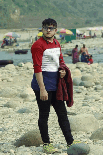 a young man wearing sunglasses and a shirt that says ' abercrombie ' on it