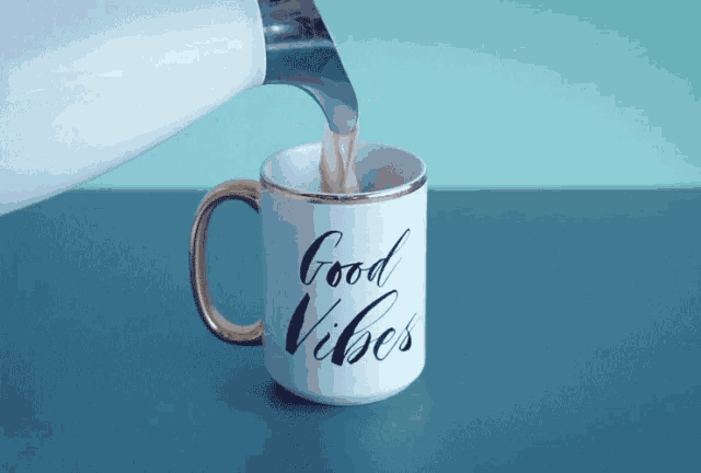a cup with the words good vibes on it