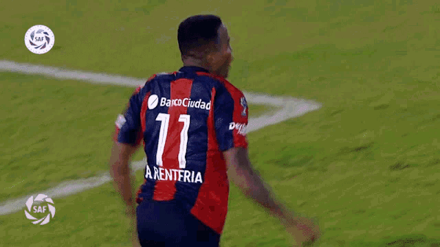 a soccer player with the number 11 on the back of his shirt