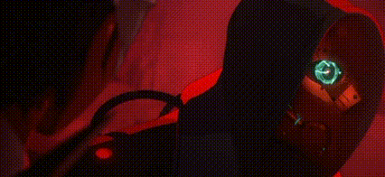 a close up of a person 's face with glowing eyes in a red light .