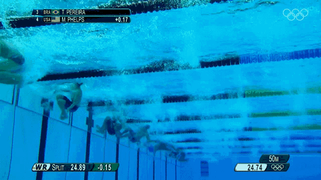 a group of swimmers are swimming in a pool and they are competing in the 50m freestyle
