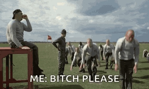 a group of men are running in a field and a man is sitting on a bench and says me bitch please