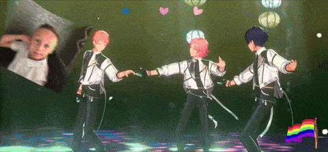 three anime characters are dancing on a stage in front of a baby .