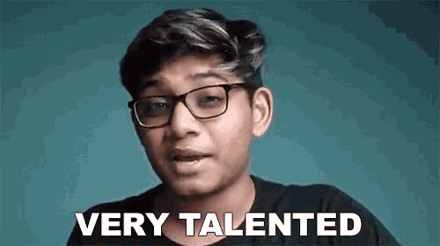 a young man wearing glasses is making a very talented face .